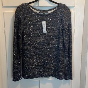 Double lined navy blue sweater with silver sequences and threading.